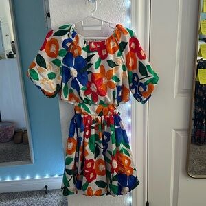 Colorful floral dress with short puffy
sleeves and adjustable waist with bow